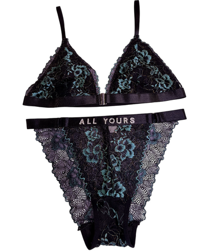 Black lace lingerie set with floral patterns on a white background