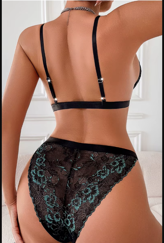 Black lace lingerie set on a neutral background