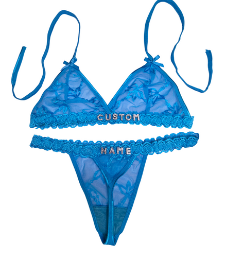 Blue lace lingerie set with 'CUSTOM NAME' embroidery on a white background