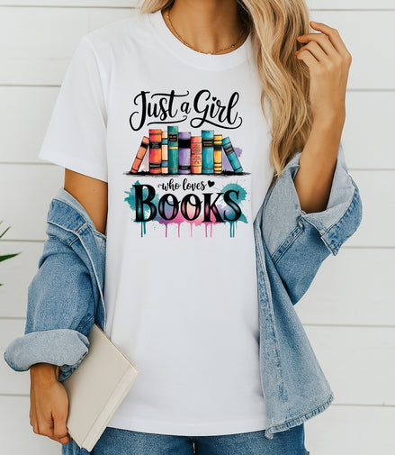 Woman wearing white Just a Girl Who Loves Books graphic T-shirt, handmade organic cotton literary tee for book lovers and readers