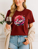 Woman wearing Maroon Love Rose graphic T-shirt with red rose and splash design, handmade organic cotton romantic and trendy fashion tee