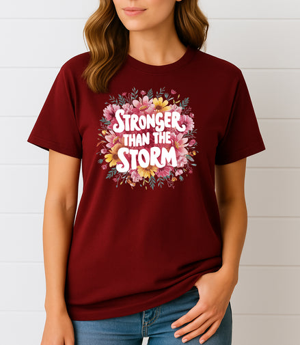 Woman wearing Maroon Stronger Than the Storm floral graphic T-shirt, handmade organic cotton empowering fashion tee