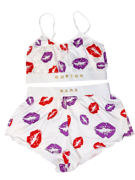Children's outfit with top and shorts featuring lip print on a white background