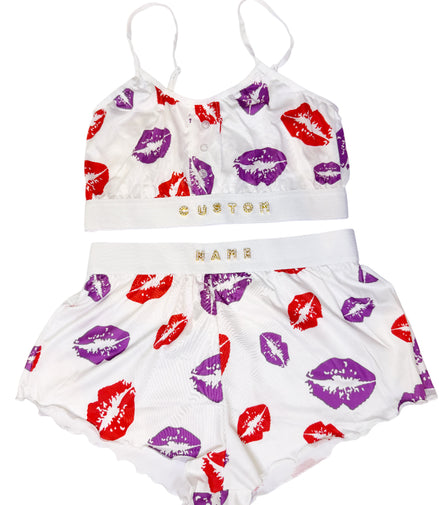 Children's outfit with top and shorts featuring lip print on a white background