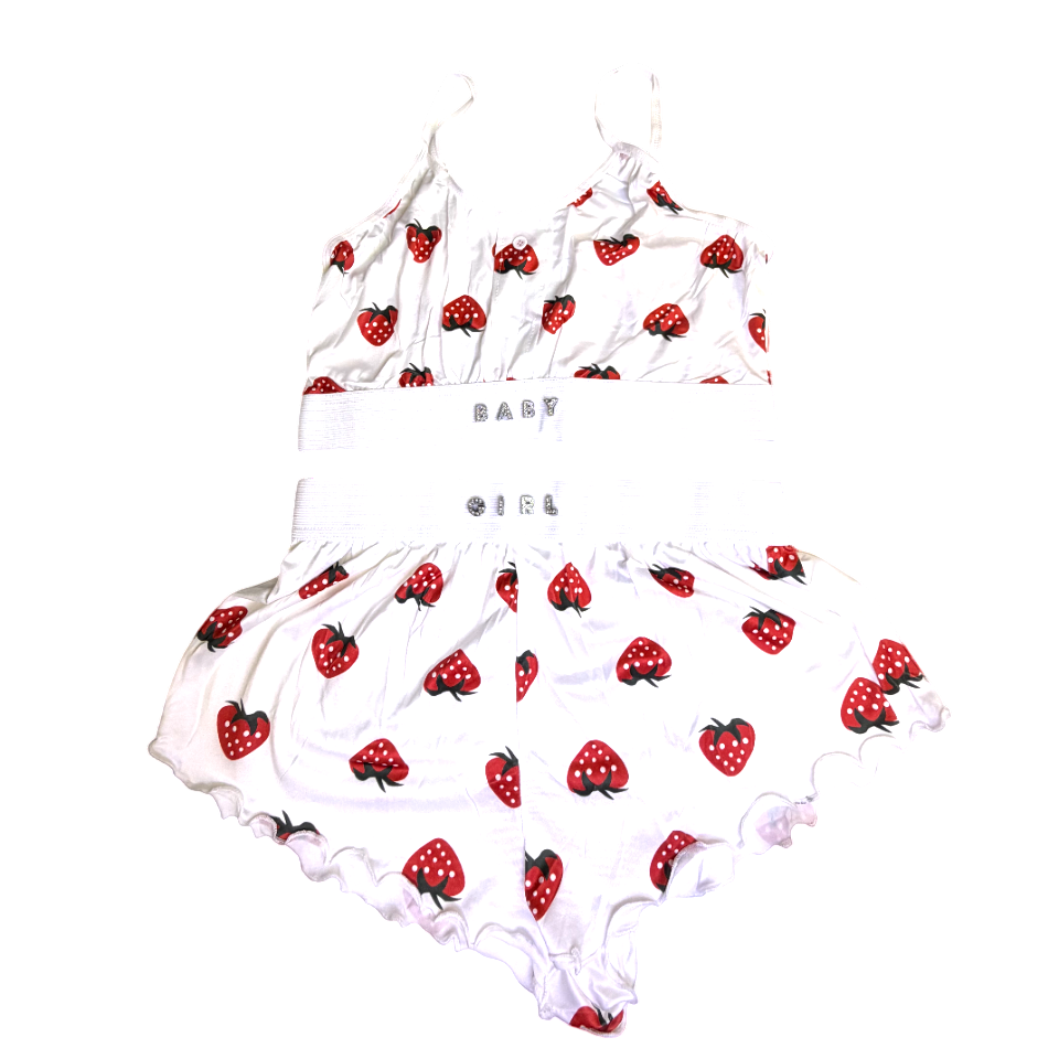 Baby girl outfit with strawberry pattern on a white background
