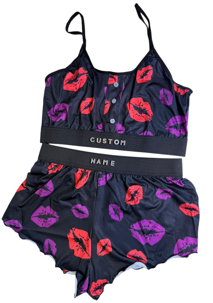 Two-piece swimsuit with lip print design on a white background