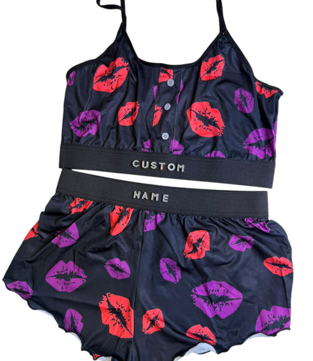 Two-piece swimsuit with lip print design on a white background