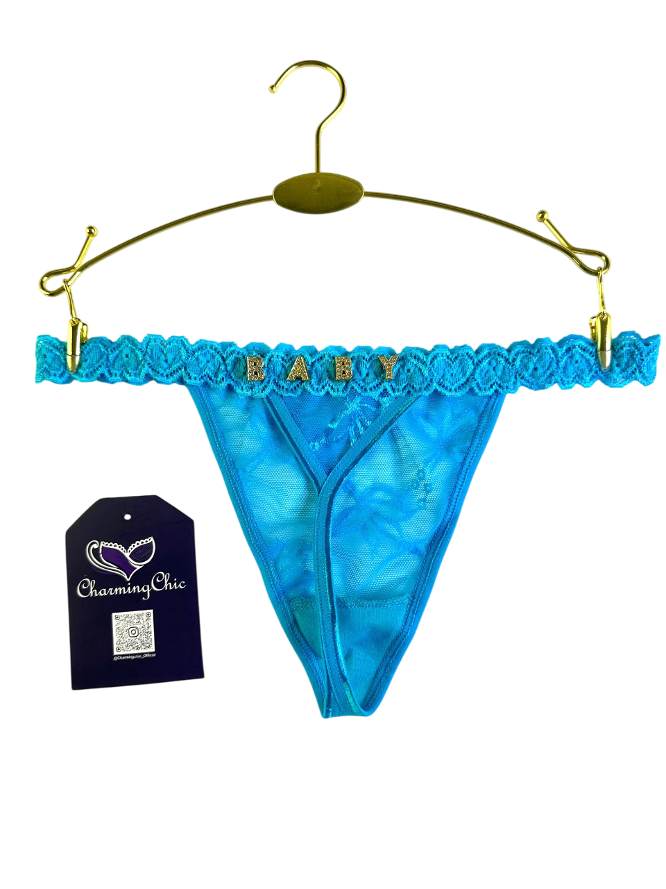 Blue lace thong with 'BABY' text on a hanger, featuring a 'Charming Chic' tag.