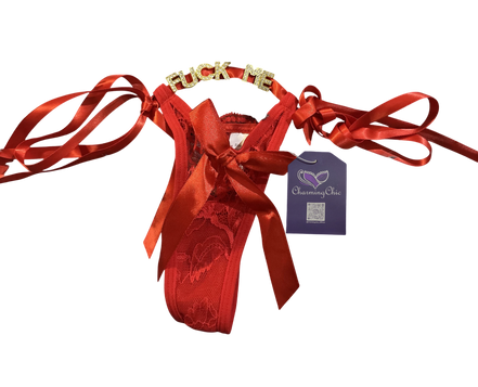 Red ballet slipper with ribbons and a tag on a white background