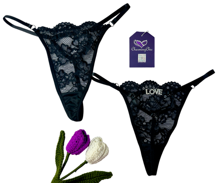 Black lace lingerie set with 'LOVE' embroidery, Charming Sue tag, and decorative flowers on a white background.