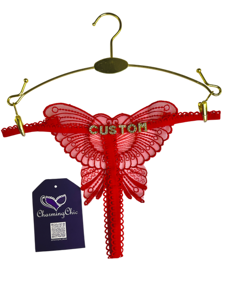 Red butterfly-shaped hanger with 'Custom' text on a white background