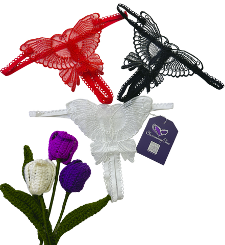 Butterfly-shaped hair accessories in red, black, and white with a tag on a white background.