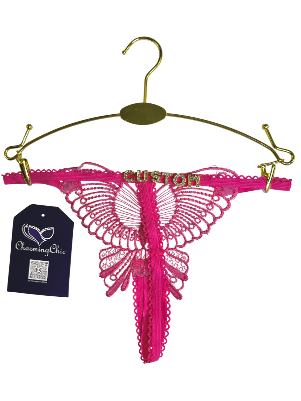 Pink lace lingerie on a gold hanger with 'Charming Chic' tag.