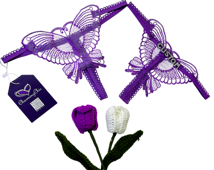 Purple lace garter set with butterfly design and 'Charmmy Chick' tag, accompanied by two knitted tulips.