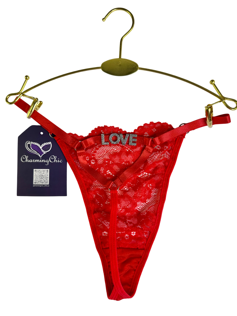 Red lace thong with 'LOVE' embroidery on a gold hanger against a white background.