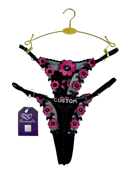 Custom embroidered floral lace thong with personalized name detail in red, white, and black colors.