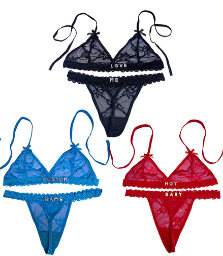 Set of three lace lingerie sets in black, blue, and red with embroidered text on a white background.