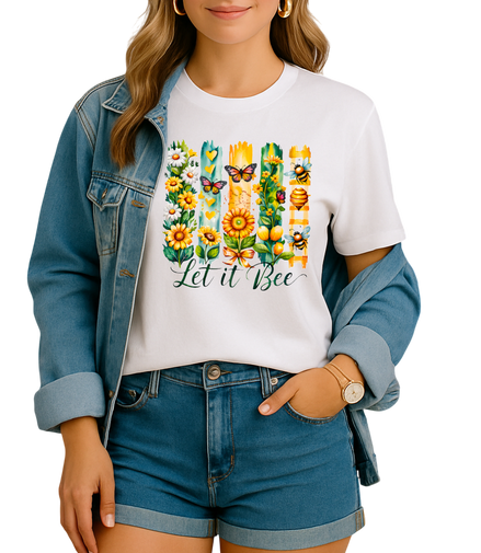 Person wearing a white t-shirt with a floral design and 'Let it Bee' text, paired with a denim jacket and shorts.